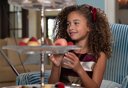 Image of a girl enjoying decadent desserts